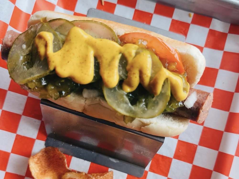 Chicago Dog with relish, pickles, tomato and mustard on a poppy seed bun at Wurst Behavior