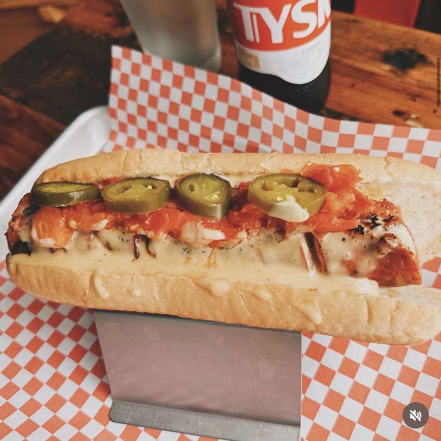 Jalapeño cheddar beer sausage with queso and Tyskie beer