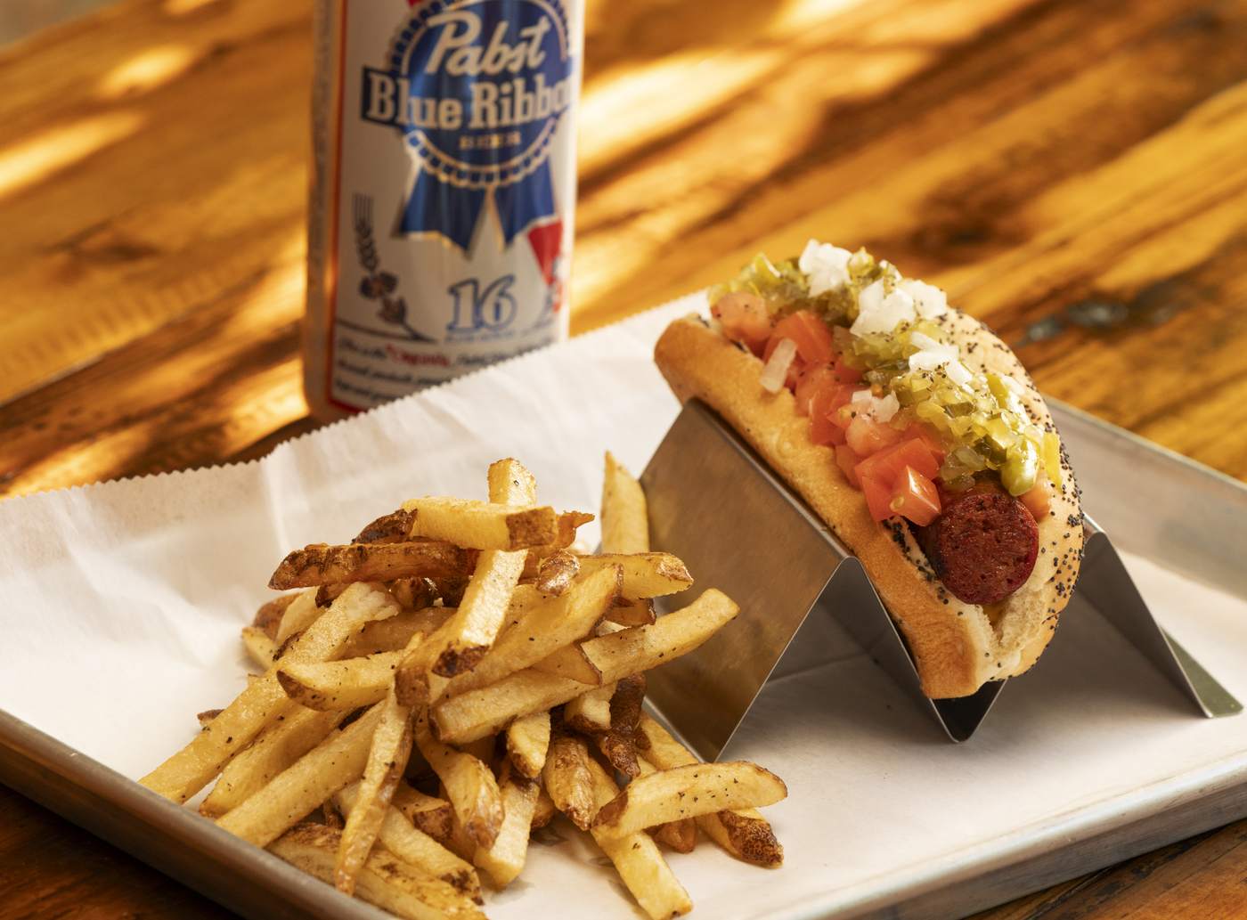 Chicago dog with fries and a PBR tallboy at Wurst Behavior smokehouse, Chicago