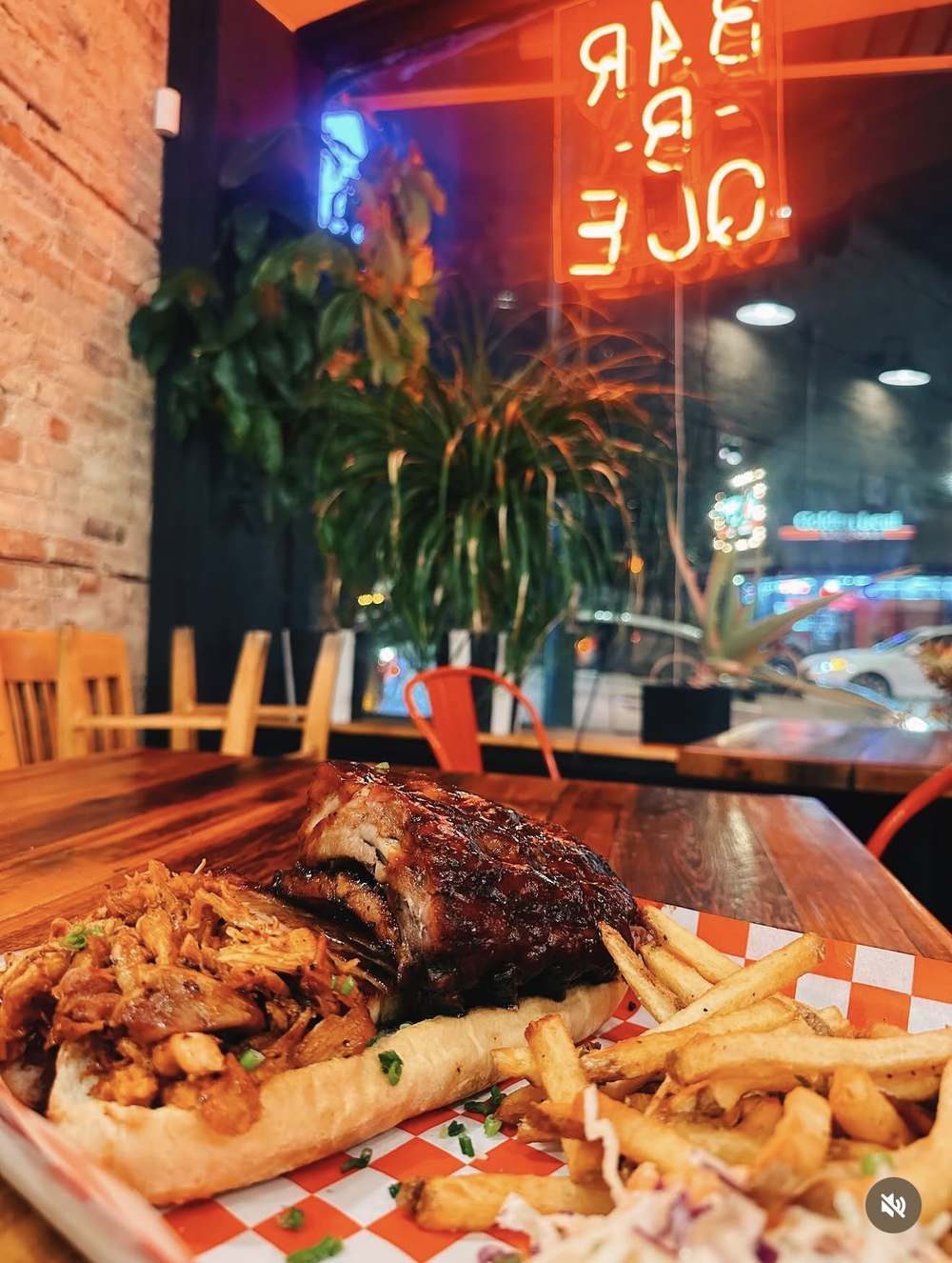 Rib and pulled pork combo under the BAR-B-QUE neon sign inside Wurst Behavior, Elston Avenue Chicago
